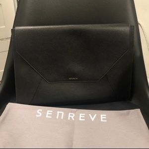 Senreve envelope sleeve clutch